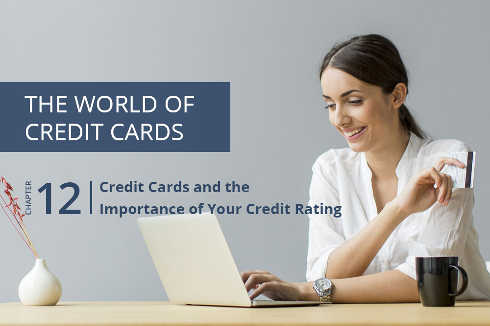 Woman holding a universal credit card while using a computer - Cashfloat